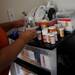 Lukequan's mother, Luneshia Williams, unpacks many medications and supplies. Melanie Maxwell I AnnArbor.com